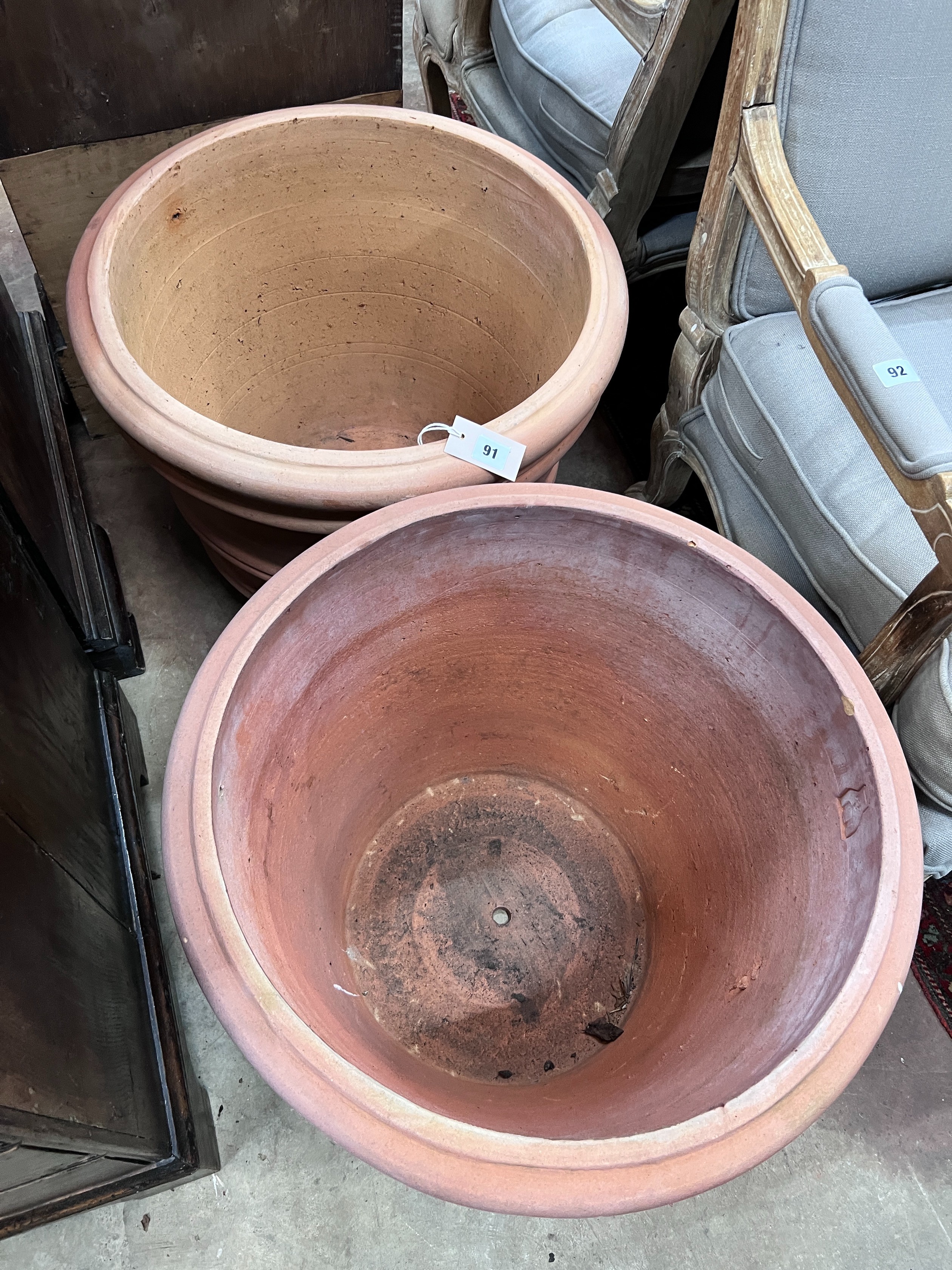 A pair of circular Italian terracotta planters, diameter 55cm, height 46cm *Please note the sale commences at 9am.